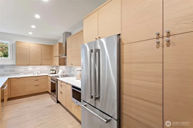 a kitchen with a sink stove and refrigerator