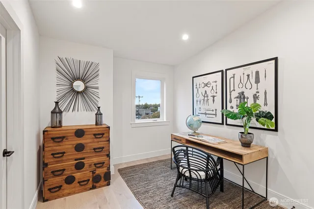 a bedroom with a large bed and a window