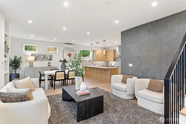 a living room with lots of furniture and window