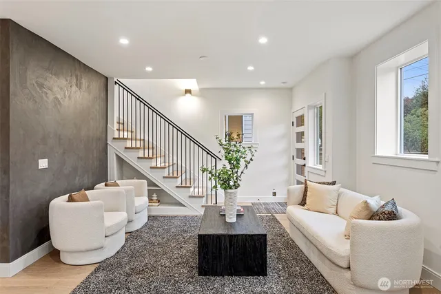 a dining room with furniture and wooden floor