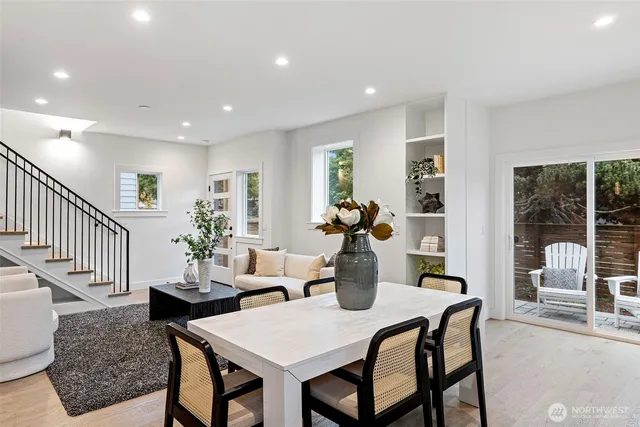 a view of a dining room with furniture window and wooden floor