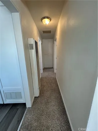 an empty room with a empty space and windows