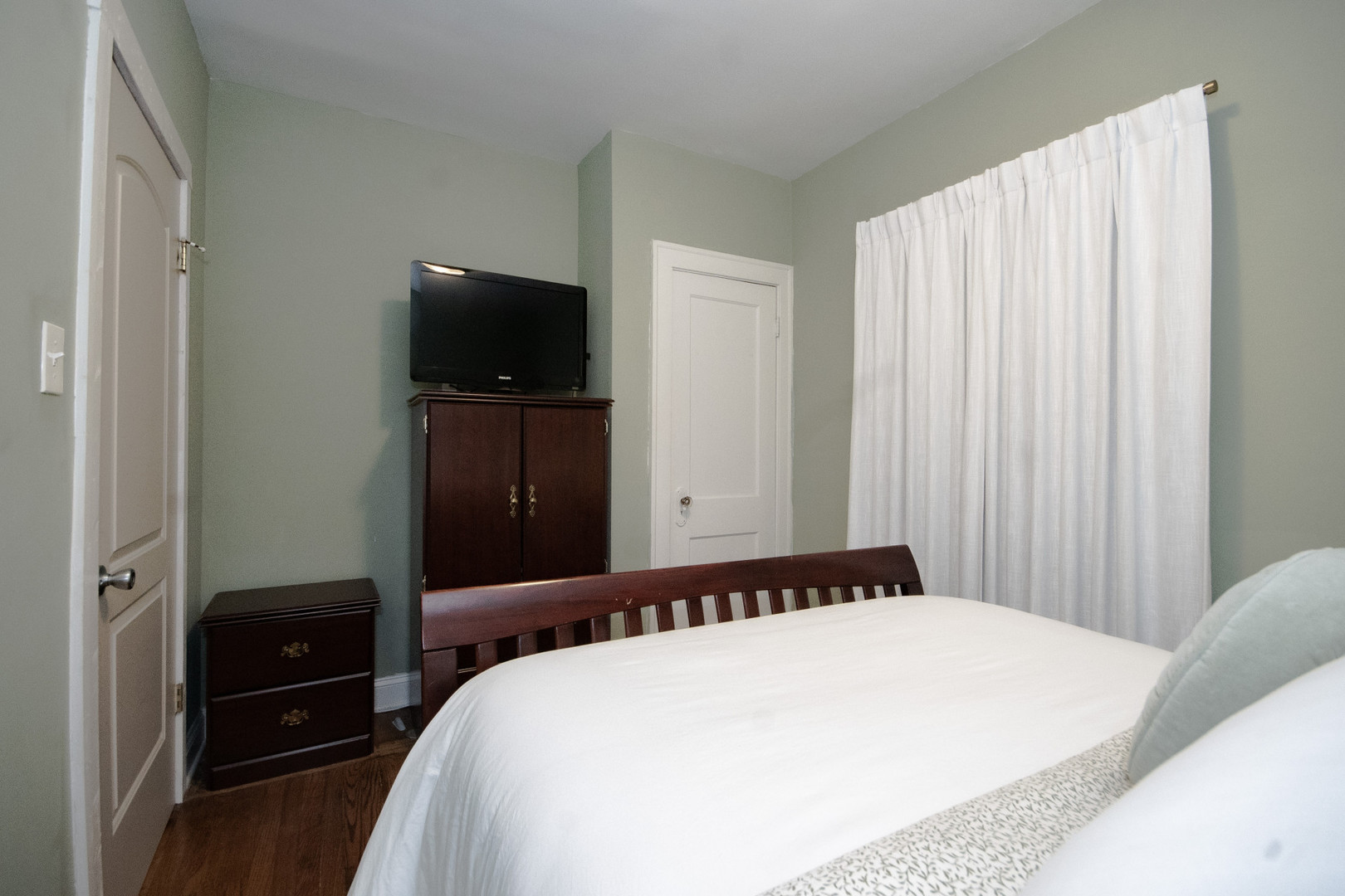 2614 Euclid Avenue Berwyn, IL 60402 - Photo 11 of 30 a bedroom with a bed and a flat screen tv