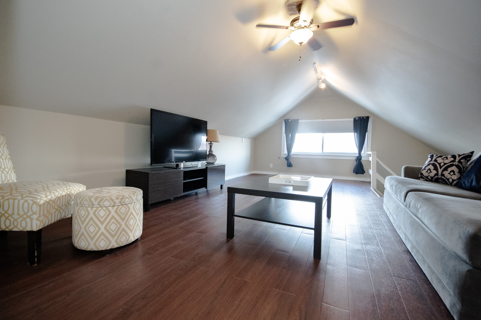 2614 Euclid Avenue Berwyn, IL 60402 - Photo 16 of 30 a living room with furniture and a flat screen tv