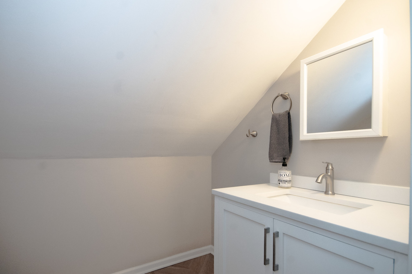 2614 Euclid Avenue Berwyn, IL 60402 - Photo 19 of 30 a bathroom with a sink and a mirror
