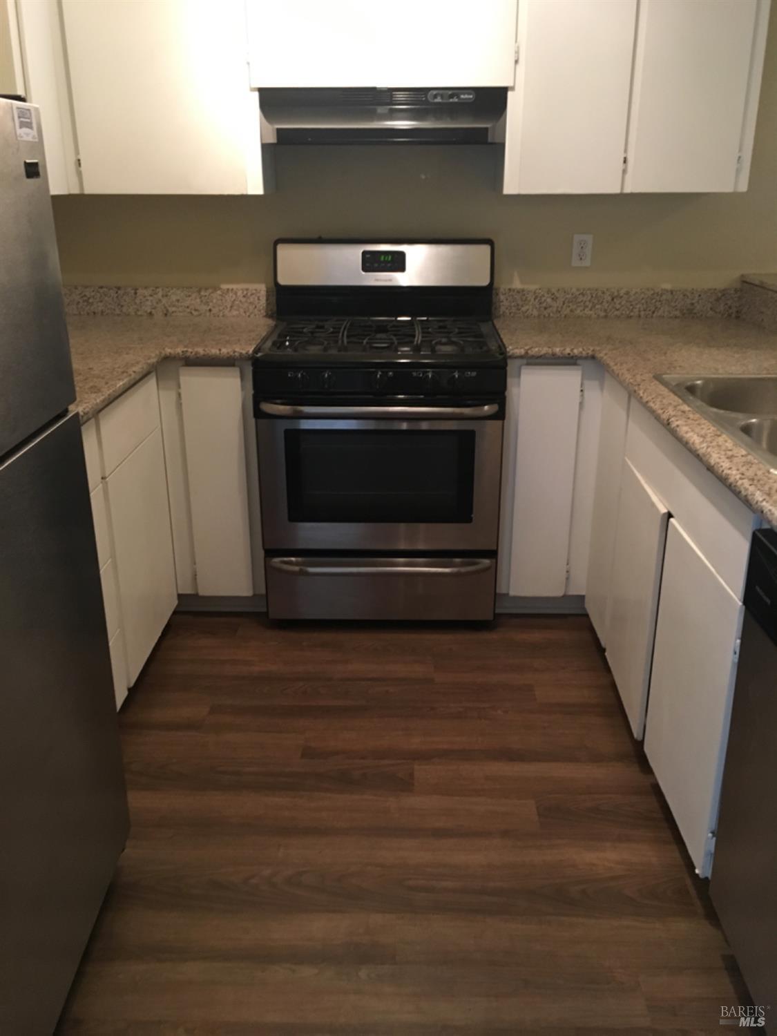 7643 Camino Colegio Rohnert Park, CA 94928 - Photo 3 of 10 a stove top oven sitting inside of a kitchen