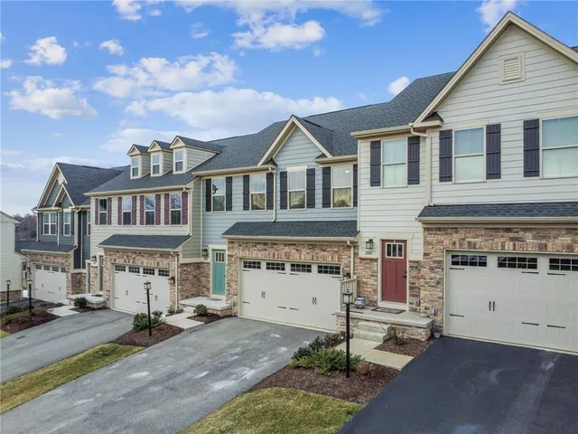 front view of a house with a street