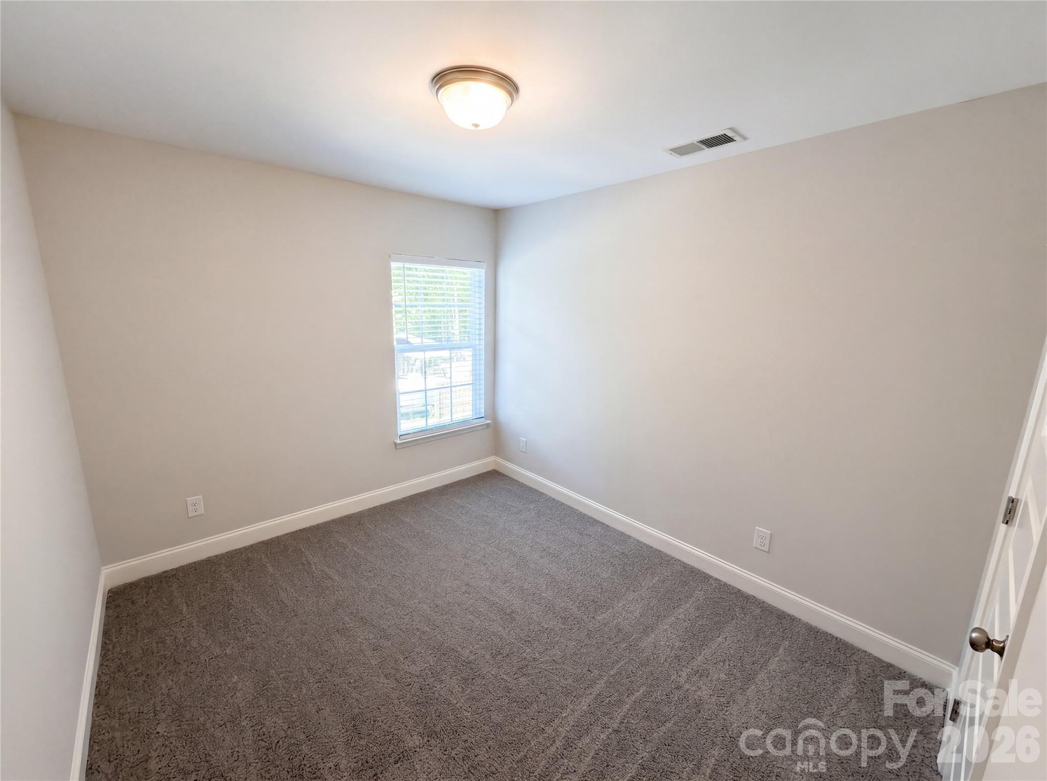 4918 Griffith Road Monroe, NC 28112 - Photo 9 of 17 an empty room with windows