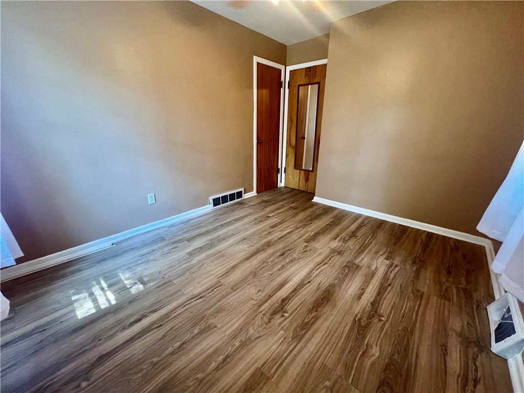 2722 Old Plank Road New Castle, PA 16105 - Photo 11 of 12 a view of an empty room with wooden floor