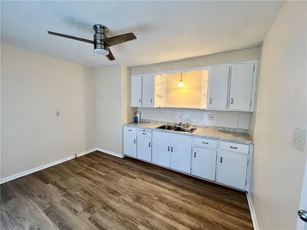 2722 Old Plank Road New Castle, PA 16105 - Photo 4 of 12 a kitchen with sink cabinets and window