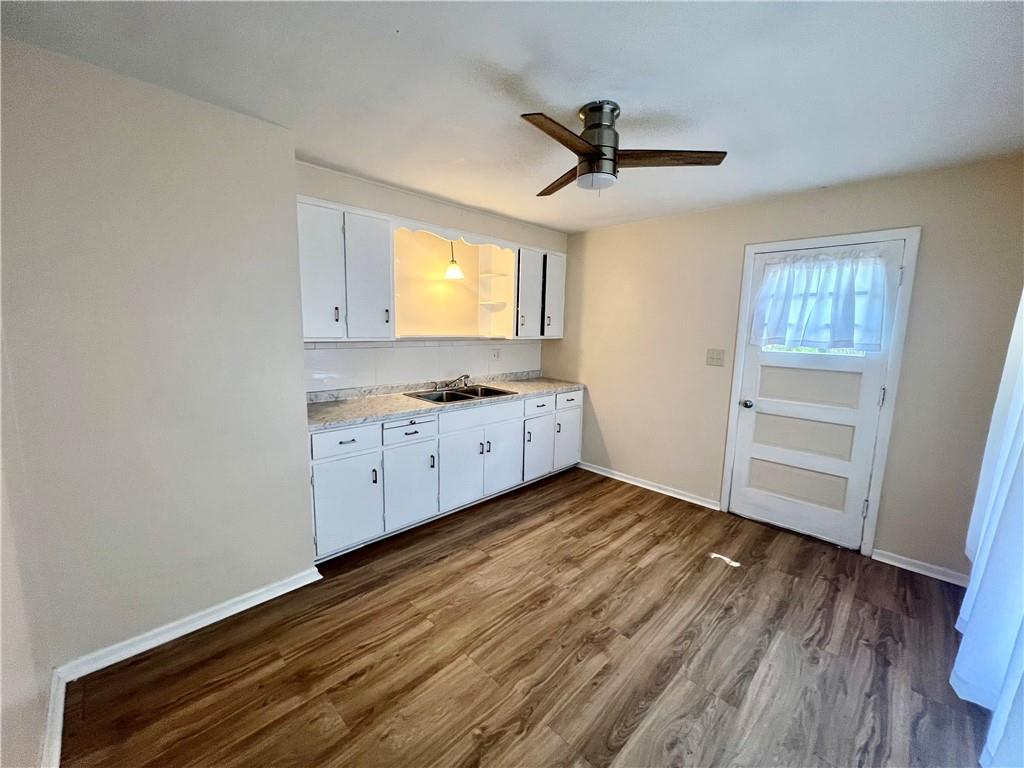 2722 Old Plank Road New Castle, PA 16105 - Photo 5 of 12 a view of a kitchen with a sink wooden floor and a window