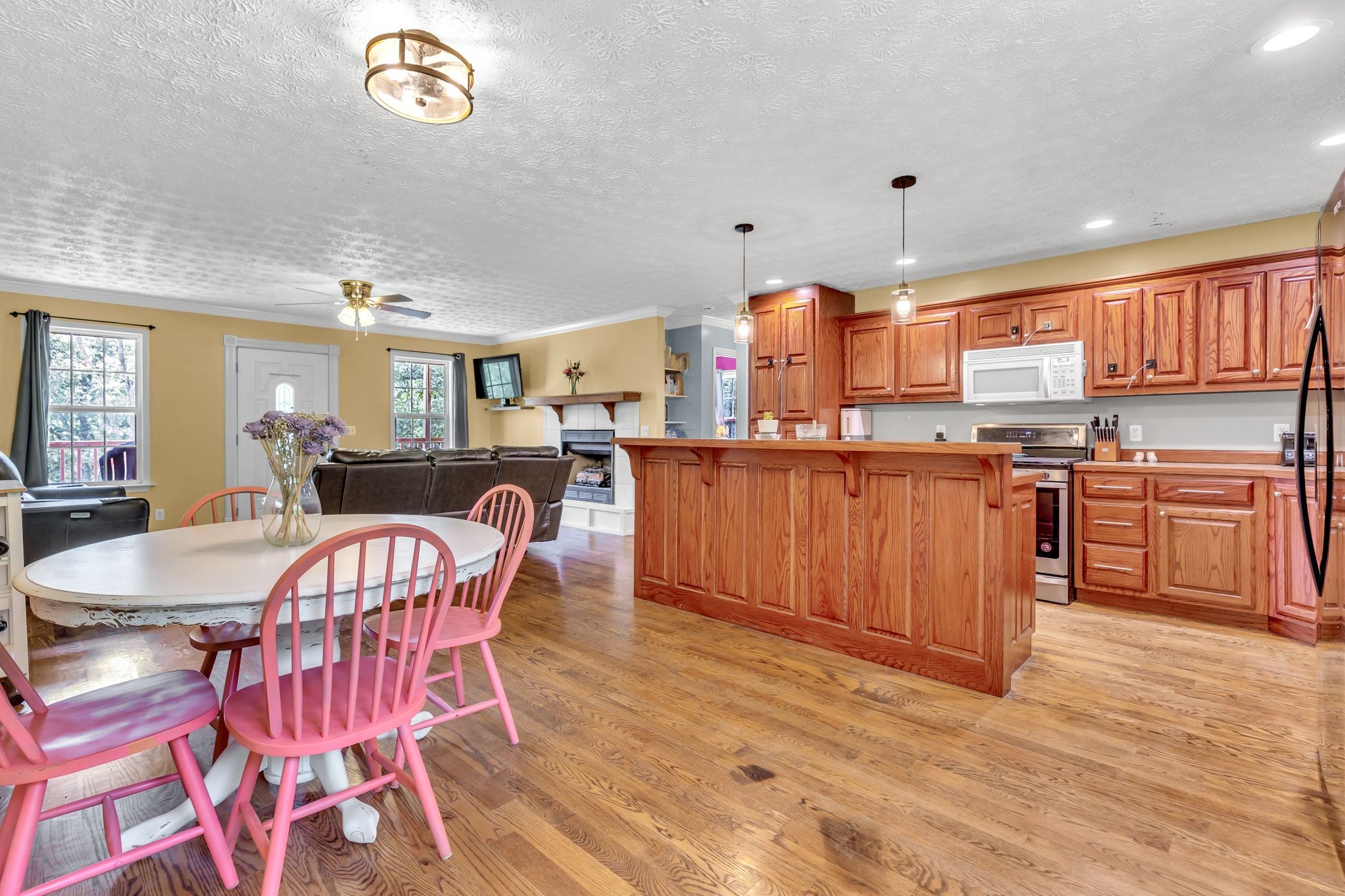 1450 Pleasant Hill Road McMinnville, TN 37110 - Photo 13 of 33 a kitchen with stainless steel appliances granite countertop a table chairs and a refrigerator