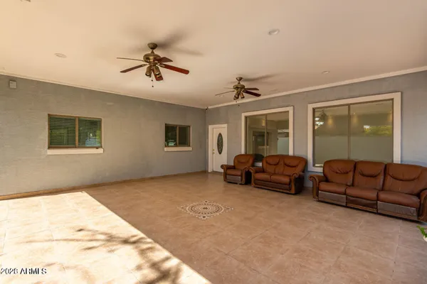 a living room with furniture and a window