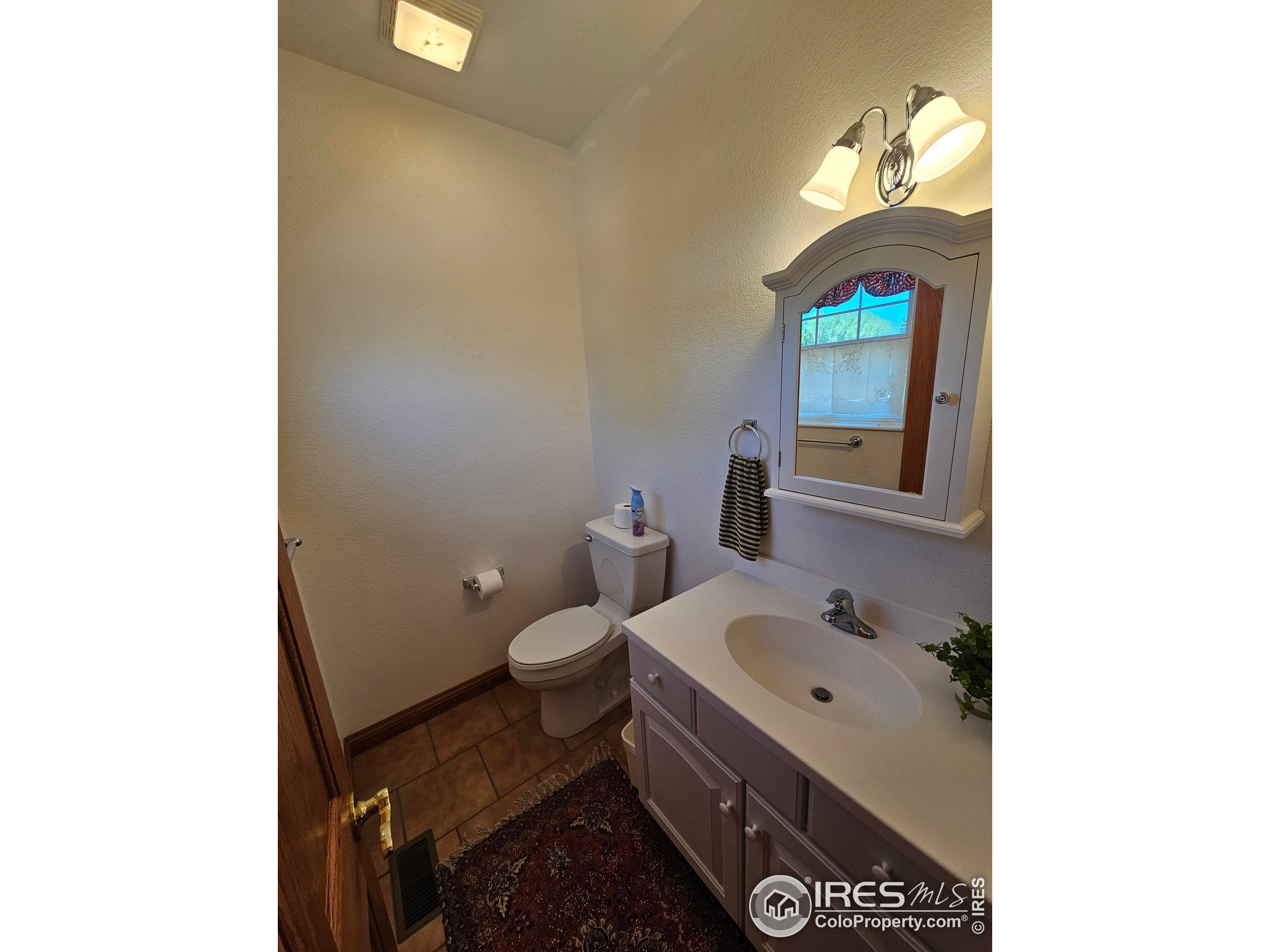 17606 County Rd Q.8 Fort Morgan, CO 80701 - Photo 35 of 37 a bathroom with a sink and a toilet