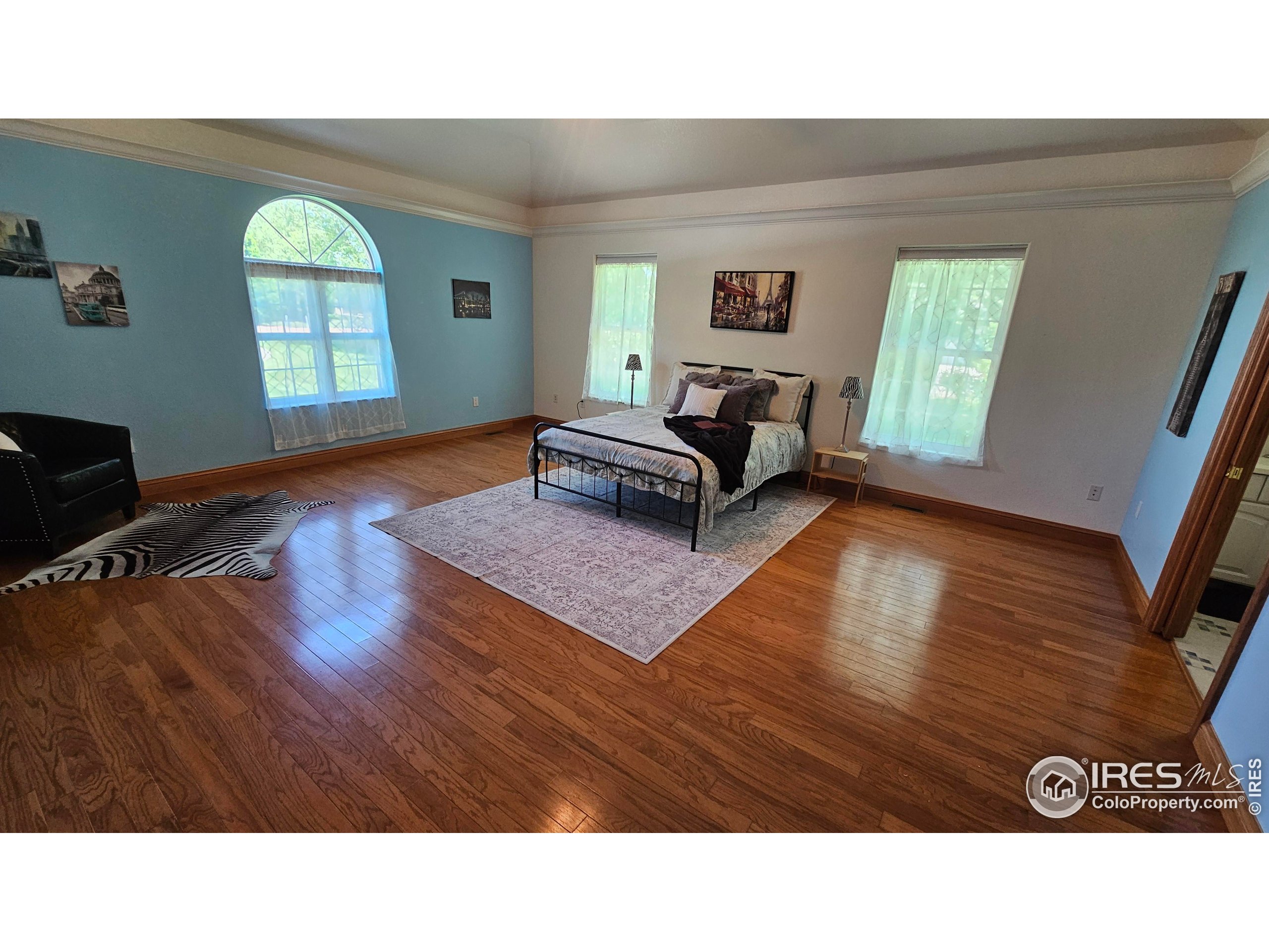 17606 County Rd Q.8 Fort Morgan, CO 80701 - Photo 6 of 37 a living room with a bed furniture and a window