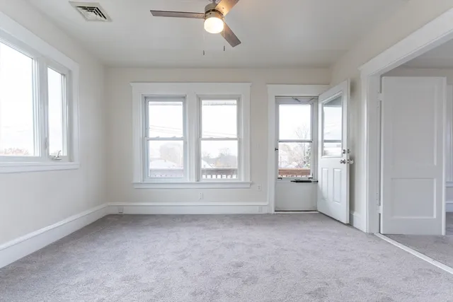 an empty room with a empty space and a window