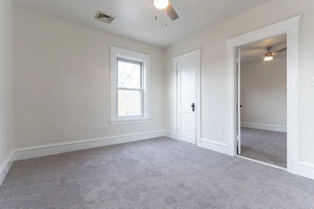 a view of a balcony with wooden floor