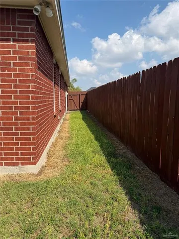 a view of a backyard with a tree