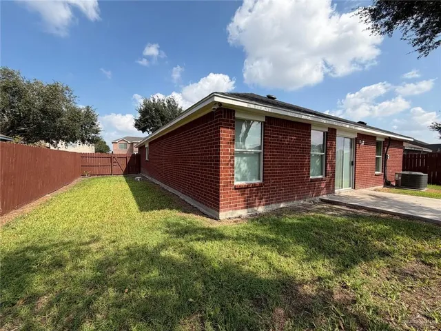 a backyard of a house with lots of green space