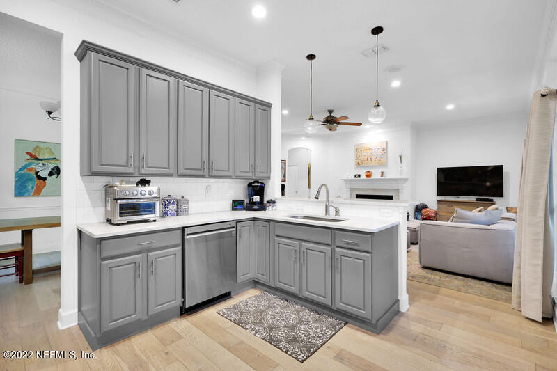 492 Big Tree Road Ponte Vedra Beach, FL 32082 - Photo 13 of 32 a kitchen with a sink cabinets and window