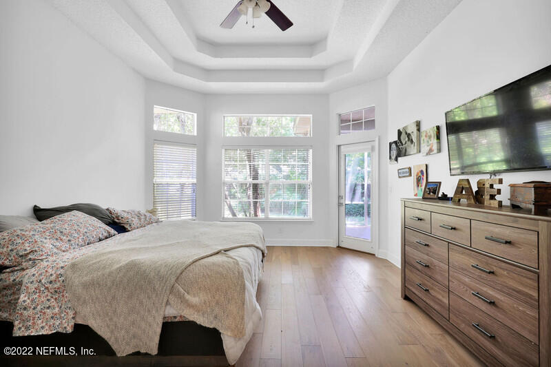492 Big Tree Road Ponte Vedra Beach, FL 32082 - Photo 16 of 32 a bedroom with a bed and a flat screen tv