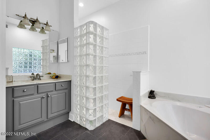 492 Big Tree Road Ponte Vedra Beach, FL 32082 - Photo 19 of 32 a bathroom with double vanity and a bathtub