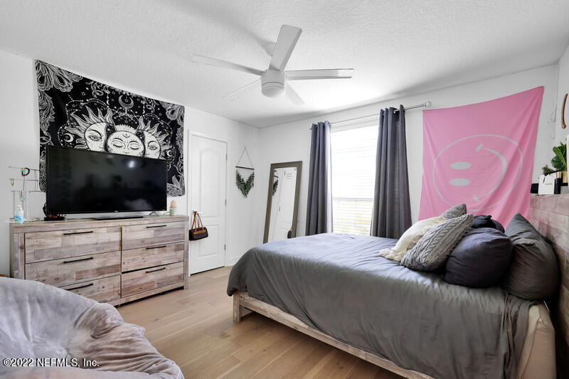 492 Big Tree Road Ponte Vedra Beach, FL 32082 - Photo 21 of 32 a bedroom with a bed and a flat screen tv