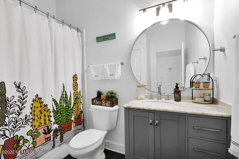 492 Big Tree Road Ponte Vedra Beach, FL 32082 - Photo 23 of 32 a bathroom with a toilet a sink and a mirror