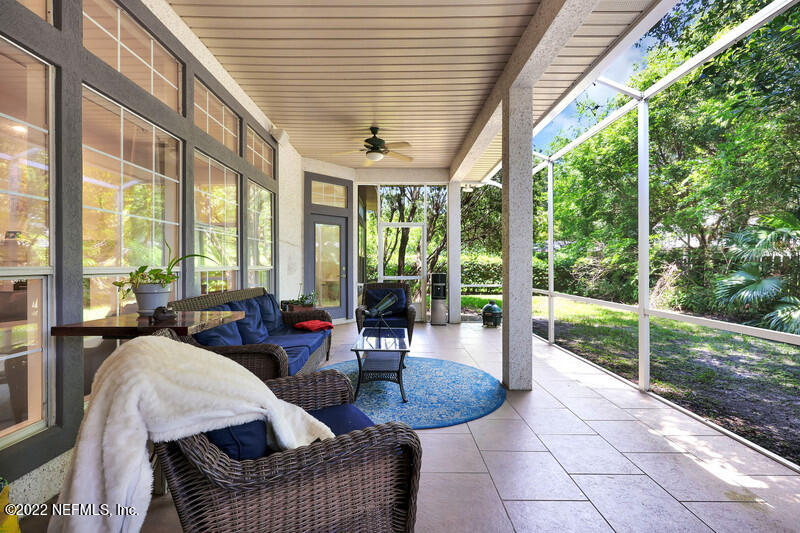 492 Big Tree Road Ponte Vedra Beach, FL 32082 - Photo 25 of 32 a living room with furniture and floor to ceiling windows