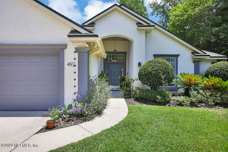 492 Big Tree Road Ponte Vedra Beach, FL 32082 - Photo 3 of 32 a front view of a house with a yard