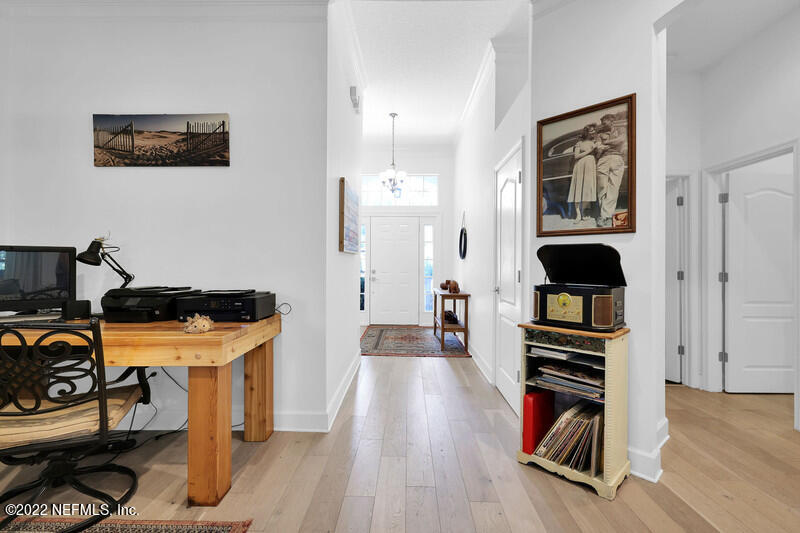 492 Big Tree Road Ponte Vedra Beach, FL 32082 - Photo 5 of 32 a view of a room with wooden floor and furniture