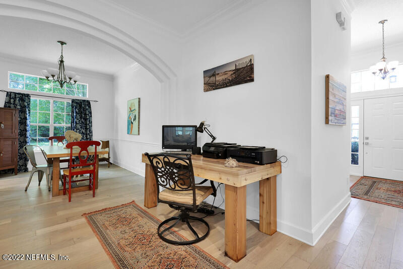492 Big Tree Road Ponte Vedra Beach, FL 32082 - Photo 6 of 32 a view of a workspace with furniture and a livingroom