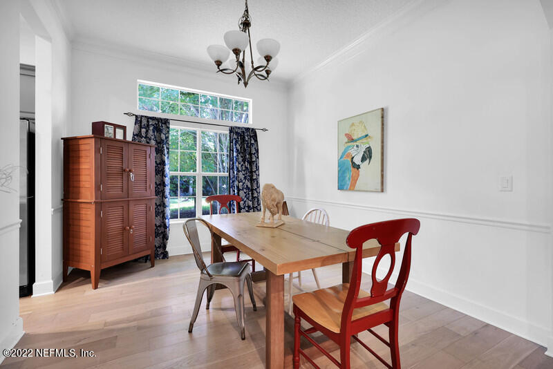 492 Big Tree Road Ponte Vedra Beach, FL 32082 - Photo 7 of 32 a dining room with furniture a chandelier and window