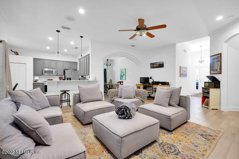 492 Big Tree Road Ponte Vedra Beach, FL 32082 - Photo 10 of 32 a living room with furniture kitchen view and a chandelier
