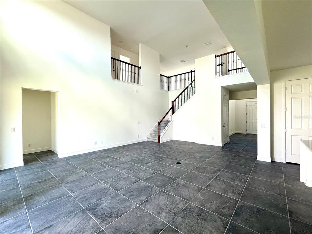 394 Switchgrass Loop Minneola, FL 34715 - Photo 5 of 26 a view of a hallway with staircase