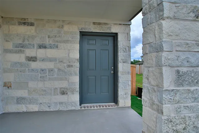 a bathroom with a shower and a sink
