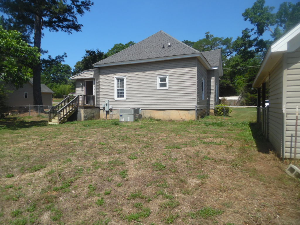 19 Haynes Street Due West, SC 29639 - Photo 2 of 8 A classic residential structure with light siding, a well-kept roof, and a tidy backyard awaiting your personal touch.