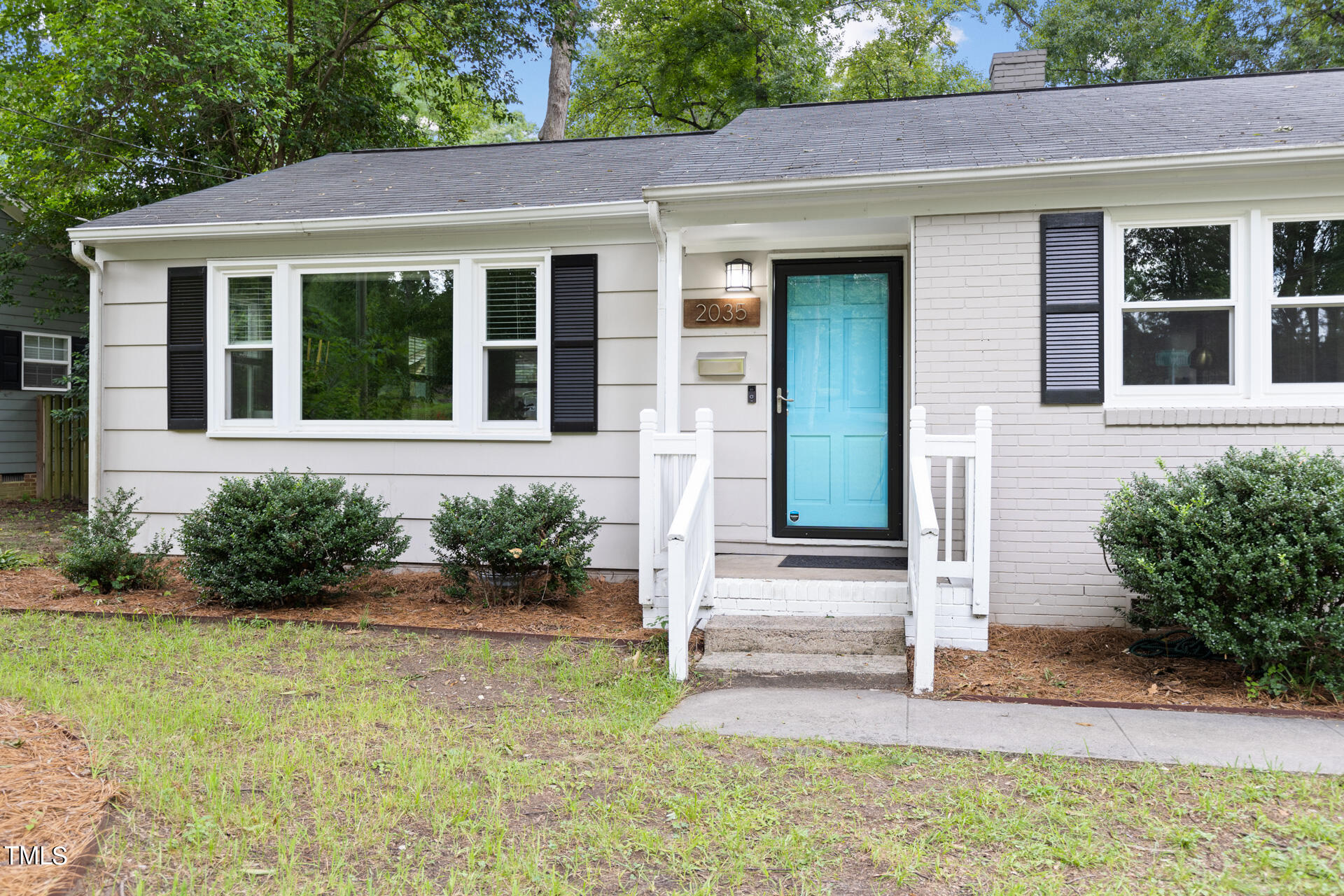 2035 Timber Drive Raleigh, NC 27604 - Photo 4 of 41 front view of a house with potted plants