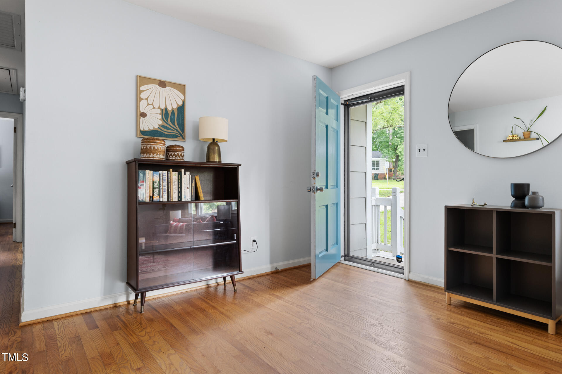2035 Timber Drive Raleigh, NC 27604 - Photo 5 of 41 wooden floor in an empty room with a window