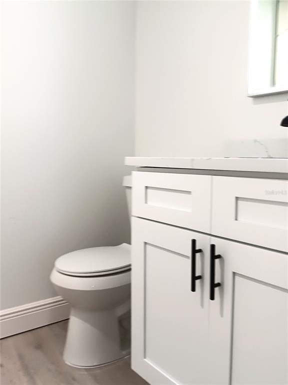 885 Beltrees Street, Unit 15 Dunedin, FL 34698 - Photo 12 of 12 a bathroom with a toilet and a sink