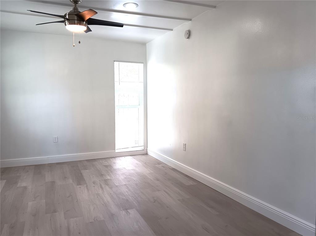 885 Beltrees Street, Unit 15 Dunedin, FL 34698 - Photo 3 of 12 a view of an empty room with a window