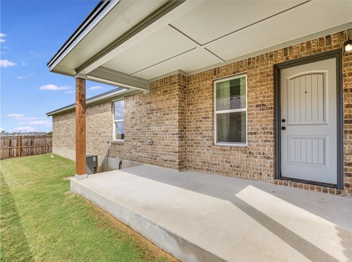113 Calvin Smith Ln. Lane Jarrell, TX 76537 - Photo 14 of 16 a front view of a house with a yard