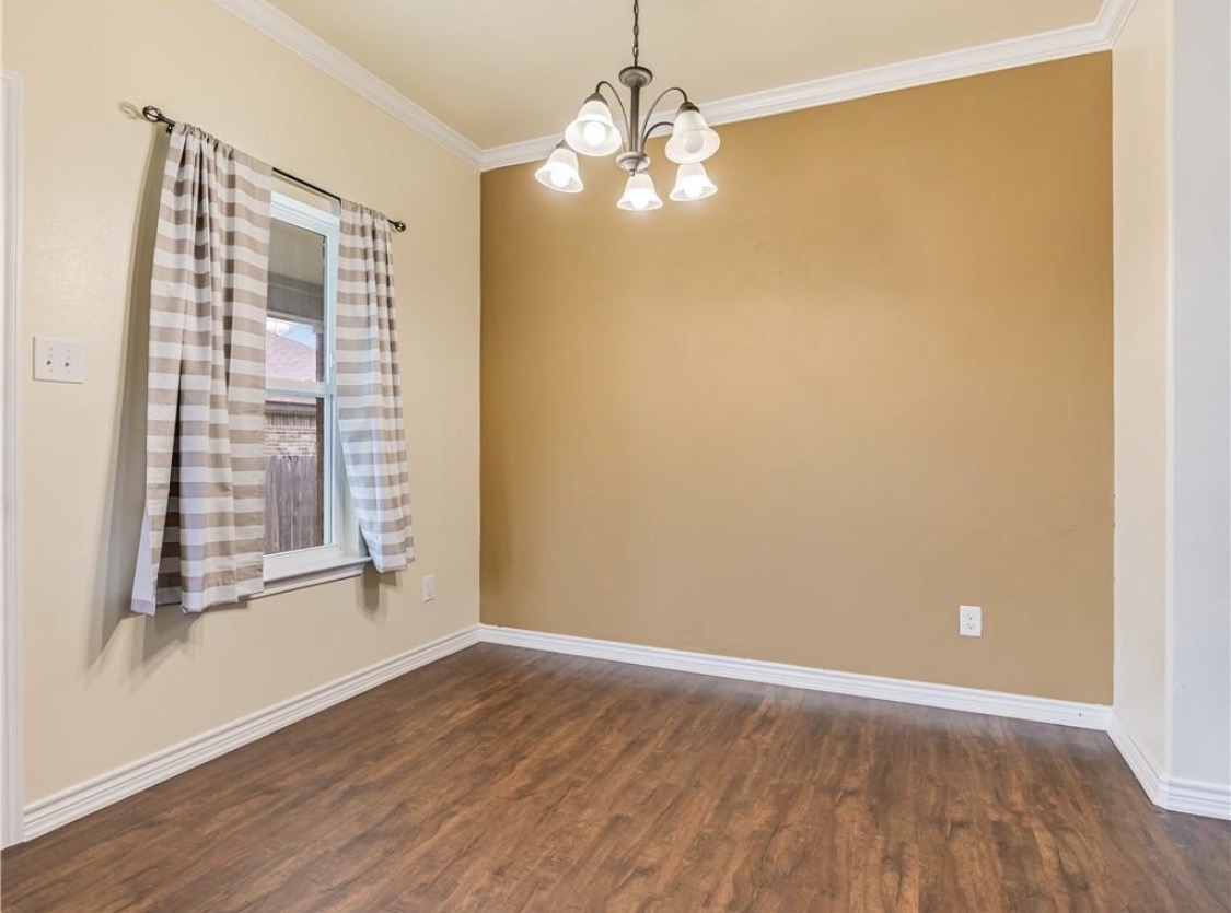 113 Calvin Smith Ln. Lane Jarrell, TX 76537 - Photo 8 of 16 a view of an empty room with wooden floor and a window