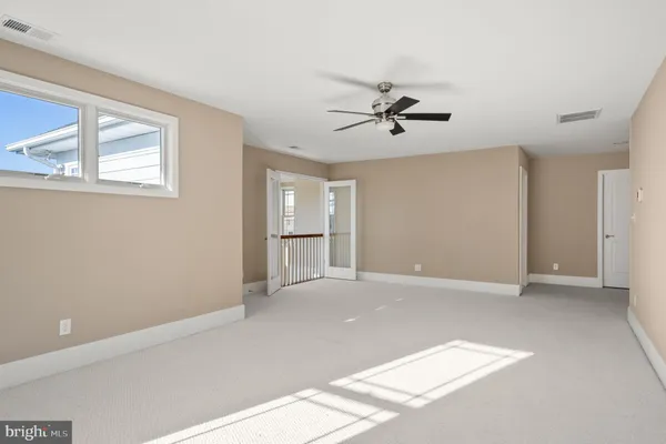 a view of empty room with windows