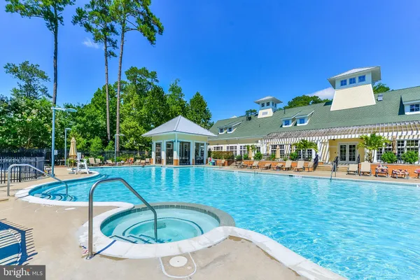 a front view of a house with swimming pool