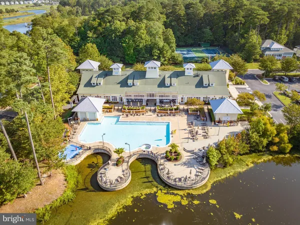 a view of a swimming pool with lounge chairs