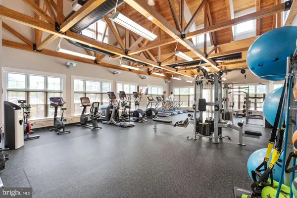 a view of a room with gym equipment and a large window