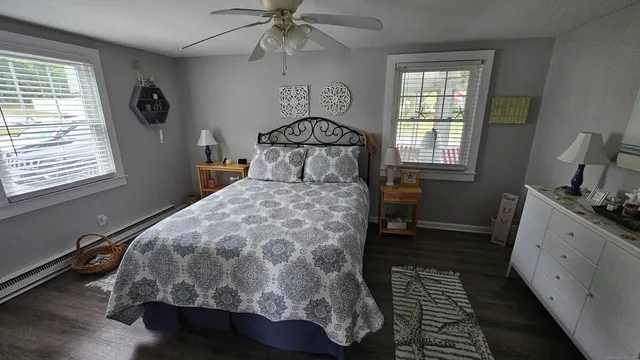 a bedroom with a large bed and a window