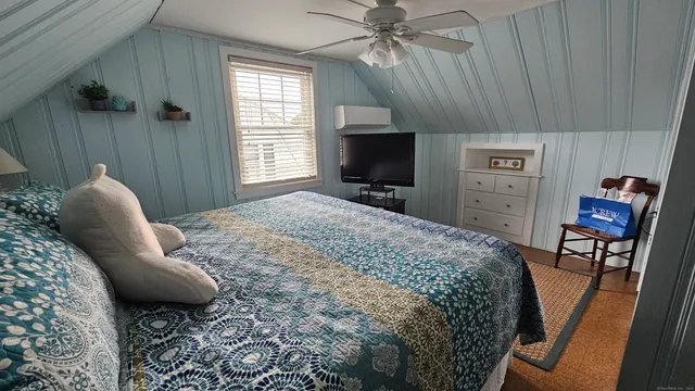 a bedroom with a bed and furniture