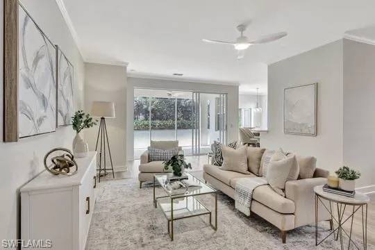 a living room with furniture a clock and a large window